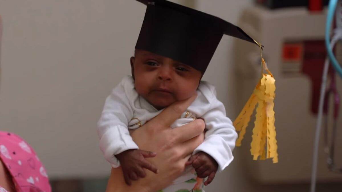 Saybie with a tiny graduation cap on leaving the hospital (Credit: Sharp HealthCare)