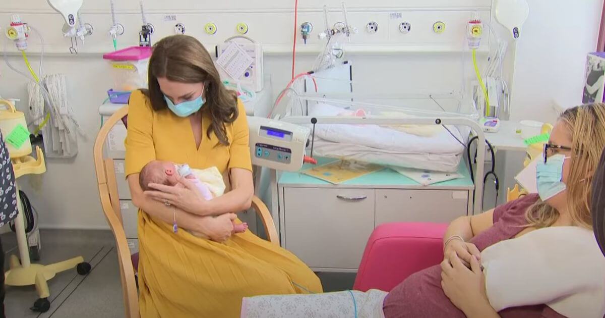 Princess of Wales cradling premature baby
