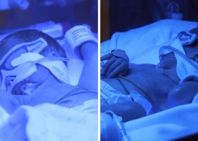 Premature twins small enough to fit into the palm of your hand home after more than 100 days in hospital